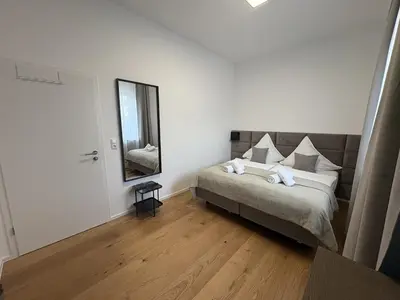 Ein Bett oder Betten in einem Zimmer der Unterkunft Große City Wohnung Rosenheim 4 Zimmer, 7 Betten