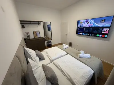Ein Bett oder Betten in einem Zimmer der Unterkunft Große City Wohnung Rosenheim 4 Zimmer, 7 Betten