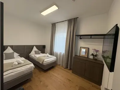 Ein Bett oder Betten in einem Zimmer der Unterkunft Große City Wohnung Rosenheim 4 Zimmer, 7 Betten