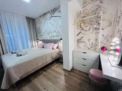Ein Bett oder Betten in einem Zimmer der Unterkunft Peony 1 - Stilvolle Sauna-Oase im Herzen der Stadt