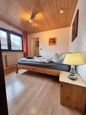 Ein Bett oder Betten in einem Zimmer der Unterkunft Ferienwohnung Buronia 2