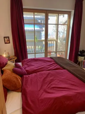 Ein Bett oder Betten in einem Zimmer der Unterkunft Sunny 100 sqm family apartment with alpine views