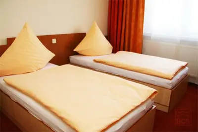 Ein Bett oder Betten in einem Zimmer der Unterkunft Pension Augsburg Ost
