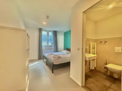 Ein Bett oder Betten in einem Zimmer der Unterkunft Pension Augsburg Ost
