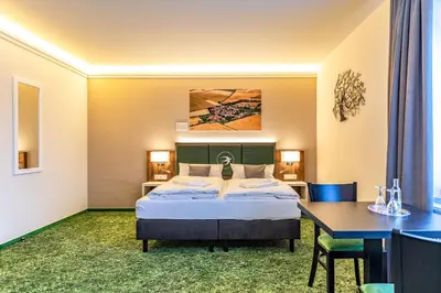 Ein Bett oder Betten in einem Zimmer der Unterkunft Pension Augsburg Ost