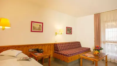Ein Bett oder Betten in einem Zimmer der Unterkunft Aparthotel Terrassenhof