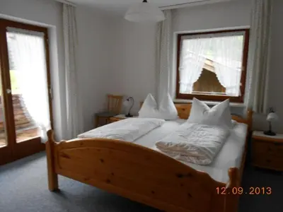 Ein Bett oder Betten in einem Zimmer der Unterkunft Schmidhauser Hof