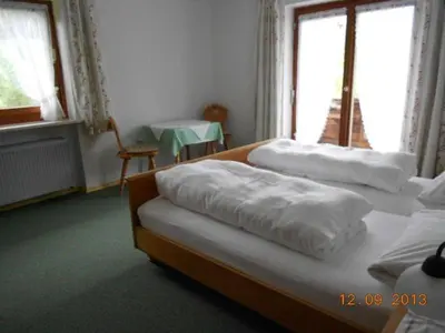 Ein Bett oder Betten in einem Zimmer der Unterkunft Schmidhauser Hof