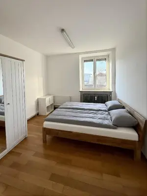Ein Bett oder Betten in einem Zimmer der Unterkunft Wohnung mit mehreren Zimmern im Schlachthofquartier - Ideal für Monteure
