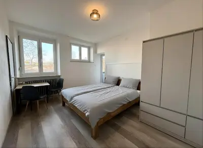 Ein Bett oder Betten in einem Zimmer der Unterkunft Wohnung mit mehreren Zimmern im Schlachthofquartier - Ideal für Monteure