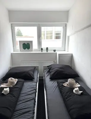Ein Bett oder Betten in einem Zimmer der Unterkunft Business Apartments 2 in Augsburg Lechhausen