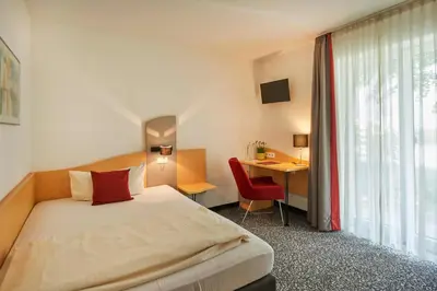 Ein Bett oder Betten in einem Zimmer der Unterkunft Gasthaus Alter Wirt