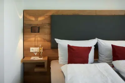 Ein Bett oder Betten in einem Zimmer der Unterkunft Gasthaus Alter Wirt