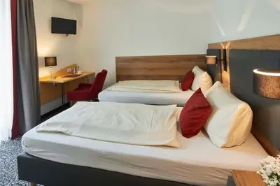 Ein Bett oder Betten in einem Zimmer der Unterkunft Gasthaus Alter Wirt