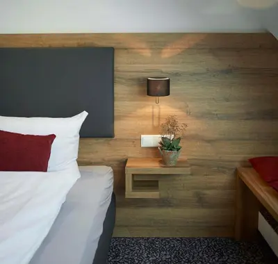 Ein Bett oder Betten in einem Zimmer der Unterkunft Gasthaus Alter Wirt