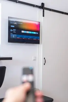 TV/Unterhaltungsangebot in der Unterkunft modernes Apartment fussläufig zum Schlosspark Nymphenburg mit guten Verkehrsanbindungen ideal für Business City-Trips und Events