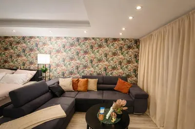Ein Sitzbereich in der Unterkunft modernes Apartment fussläufig zum Schlosspark Nymphenburg mit guten Verkehrsanbindungen ideal für Business City-Trips und Events