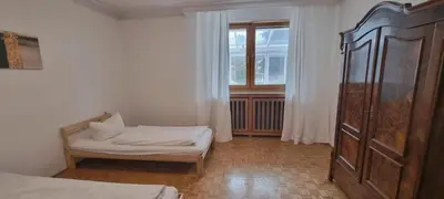 Ein Bett oder Betten in einem Zimmer der Unterkunft Apartments München-Pasing