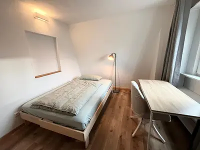 Ein Bett oder Betten in einem Zimmer der Unterkunft Wohnung für Monteure und Geschäftsreisende - Jakobervorstadt