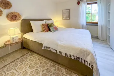 Ein Bett oder Betten in einem Zimmer der Unterkunft Chiemsee Flair