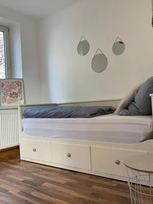 Ein Bett oder Betten in einem Zimmer der Unterkunft Modern & cozy 4-room apartment with charm