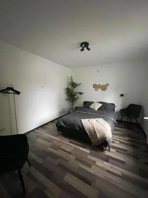 Ein Bett oder Betten in einem Zimmer der Unterkunft Modern & cozy 4-room apartment with charm