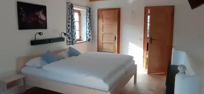 Ein Bett oder Betten in einem Zimmer der Unterkunft Wohnen beim Keramiker
