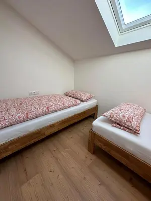 Ein Bett oder Betten in einem Zimmer der Unterkunft Ferienwohnung An der Leiten