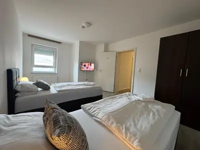 Ein Bett oder Betten in einem Zimmer der Unterkunft Pension Linderhof Augsburg