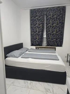 Ein Bett oder Betten in einem Zimmer der Unterkunft Hanin 9