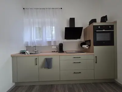 Küche/Küchenzeile in der Unterkunft Modernes zentrales Hideaway in der alten Post