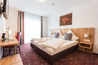 Ein Bett oder Betten in einem Zimmer der Unterkunft Schäfer Boardinghouse