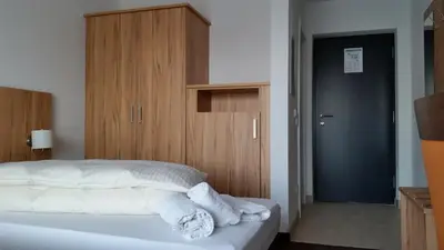 Ein Bett oder Betten in einem Zimmer der Unterkunft Schäfer Boardinghouse