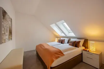 Ein Bett oder Betten in einem Zimmer der Unterkunft Hotel & Boarding House Schlosserwirt