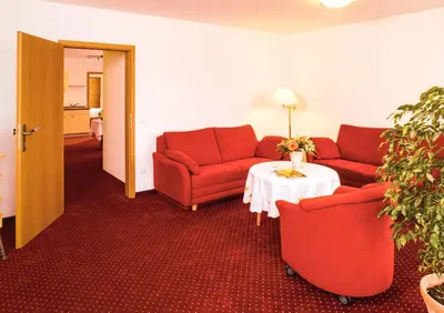 Ein Sitzbereich in der Unterkunft Ferienwohnungen Kurhotel Eichinger