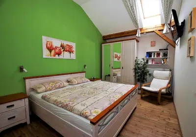 Ein Bett oder Betten in einem Zimmer der Unterkunft Ferienwohnung Benediktenwand