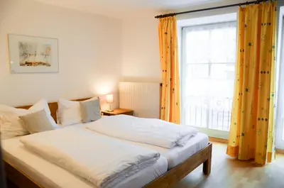 Ein Bett oder Betten in einem Zimmer der Unterkunft Hotel Blaue Traube