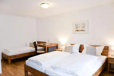 Ein Bett oder Betten in einem Zimmer der Unterkunft Hotel Blaue Traube
