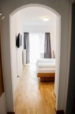 Ein Bett oder Betten in einem Zimmer der Unterkunft Hotel Blaue Traube