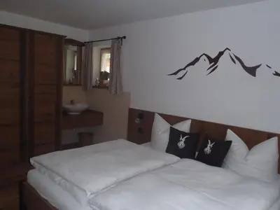 Ein Bett oder Betten in einem Zimmer der Unterkunft Ferienhaus Bergfreund