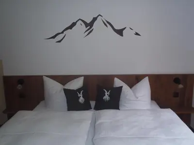 Ein Bett oder Betten in einem Zimmer der Unterkunft Ferienhaus Bergfreund