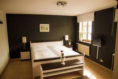 Ein Bett oder Betten in einem Zimmer der Unterkunft Gasthof Rabenwirt