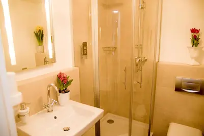 Ein Badezimmer in der Unterkunft Gasthof Rabenwirt