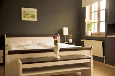 Ein Bett oder Betten in einem Zimmer der Unterkunft Gasthof Rabenwirt