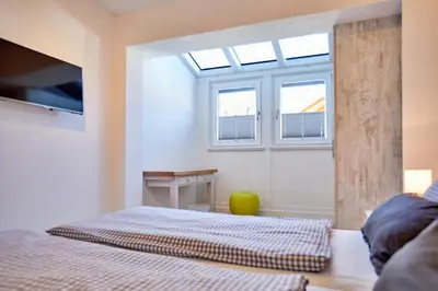 Ein Bett oder Betten in einem Zimmer der Unterkunft Ferienwohnung Alpspitze
