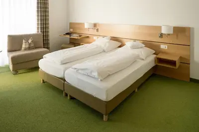 Ein Bett oder Betten in einem Zimmer der Unterkunft BSW Hotel Isarwinkel