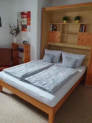 Ein Bett oder Betten in einem Zimmer der Unterkunft FeWo Steckenbergblick/Gästecard