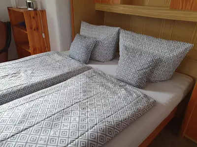 Ein Bett oder Betten in einem Zimmer der Unterkunft FeWo Steckenbergblick/Gästecard