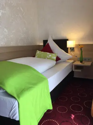 Ein Bett oder Betten in einem Zimmer der Unterkunft Waldgasthof St.Wolfgang
