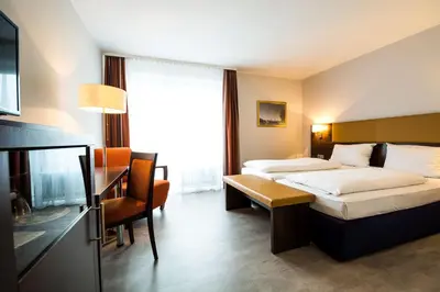 Ein Bett oder Betten in einem Zimmer der Unterkunft domus Hotel